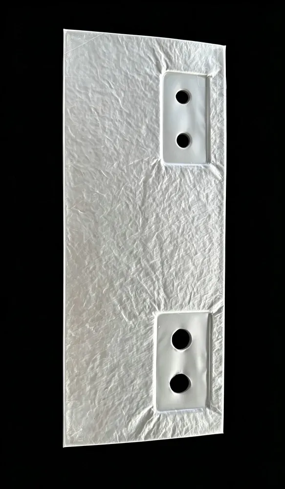 Shaped ultra-thin vacuum insulation panel for a battery insulation application. The photograph does not establish thermal-runaway protection.