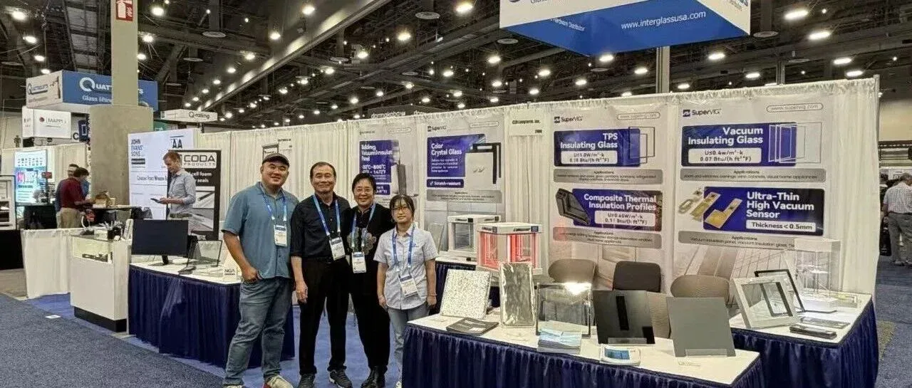 The Supertech exhibition team and visitors beside glazing and vacuum insulation samples at GlassBuild America